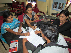 Indian students using mobile - flickr